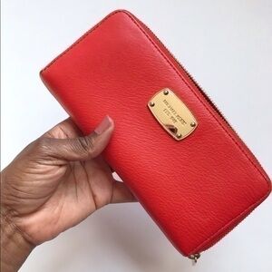 Micheal Kors Orange leather Wallet / clutch